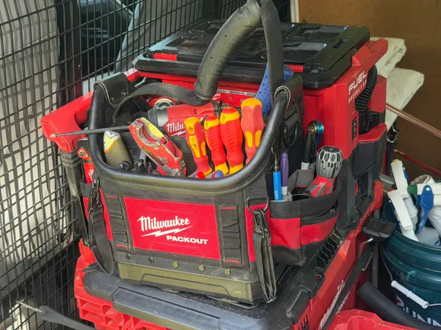 Tool bag on the ground at a hot water repair job