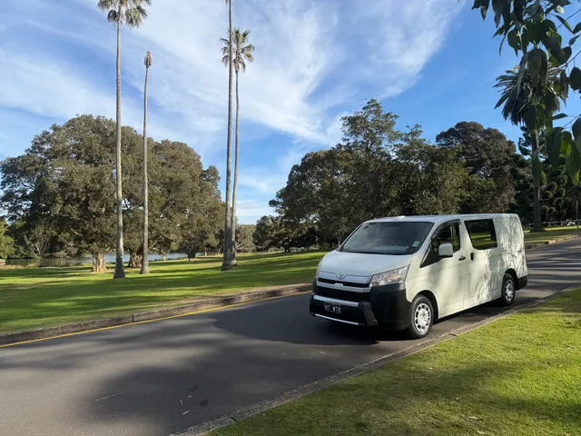 The parked Bondi Hot Water van in front of a bondi beach